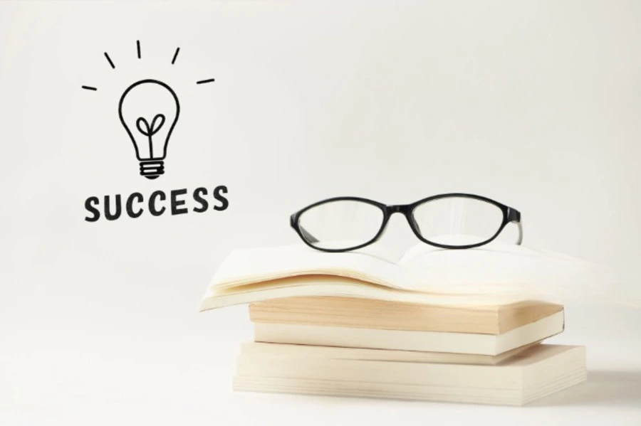 word success, books and glasses