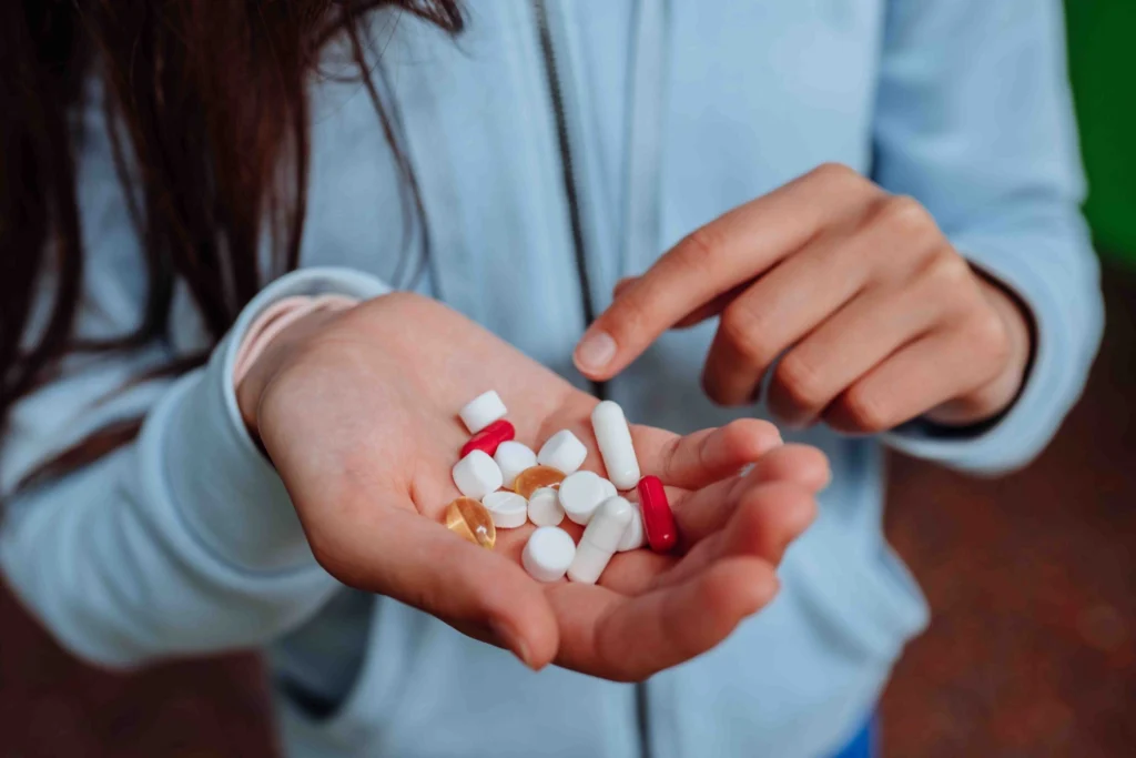woman takes shows pills